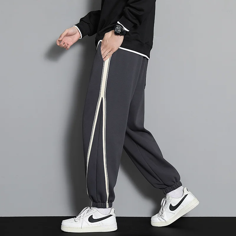 Horizon striped wool-blend jogger in neutral tones, tapered silhouette with contrast side stripes