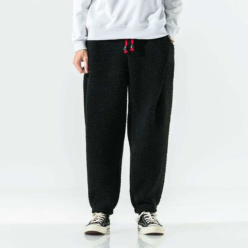 Men's loose fit gray joggers with drawstring waist and side pockets for cozy winter warmth