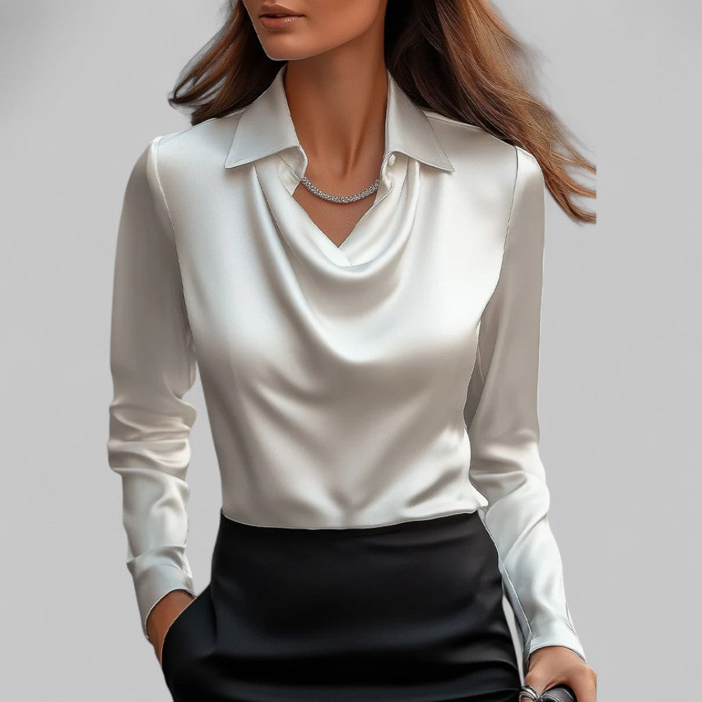 Women's ivory satin blouse with draped silhouette, structured collar, and light-catching fluid finish