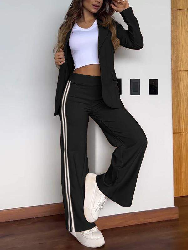 Women's tailored blazer and striped trousers two-piece office outfit, modern professional coordinated set