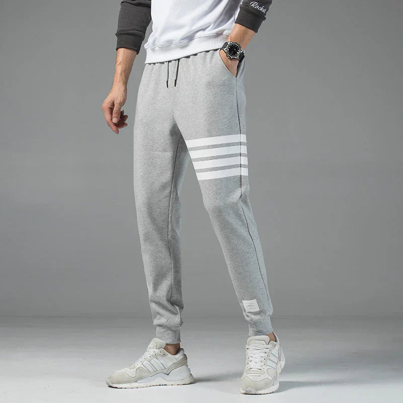 Men's gray striped cotton-blend jogger sweatpants with adjustable drawstring waist and tapered fit