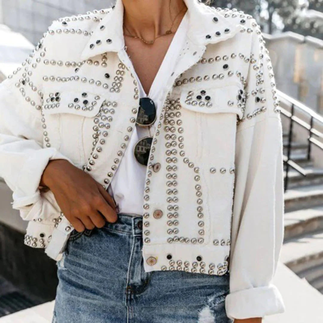 Black rivet-embellished Lokomotiv moto jacket with bold rock-chic hardware details for streetwear