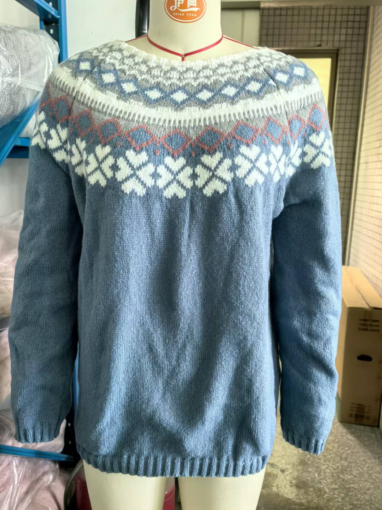 Women's textured knit sweater in cozy winter style with raised pattern for effortless cold-weather layering