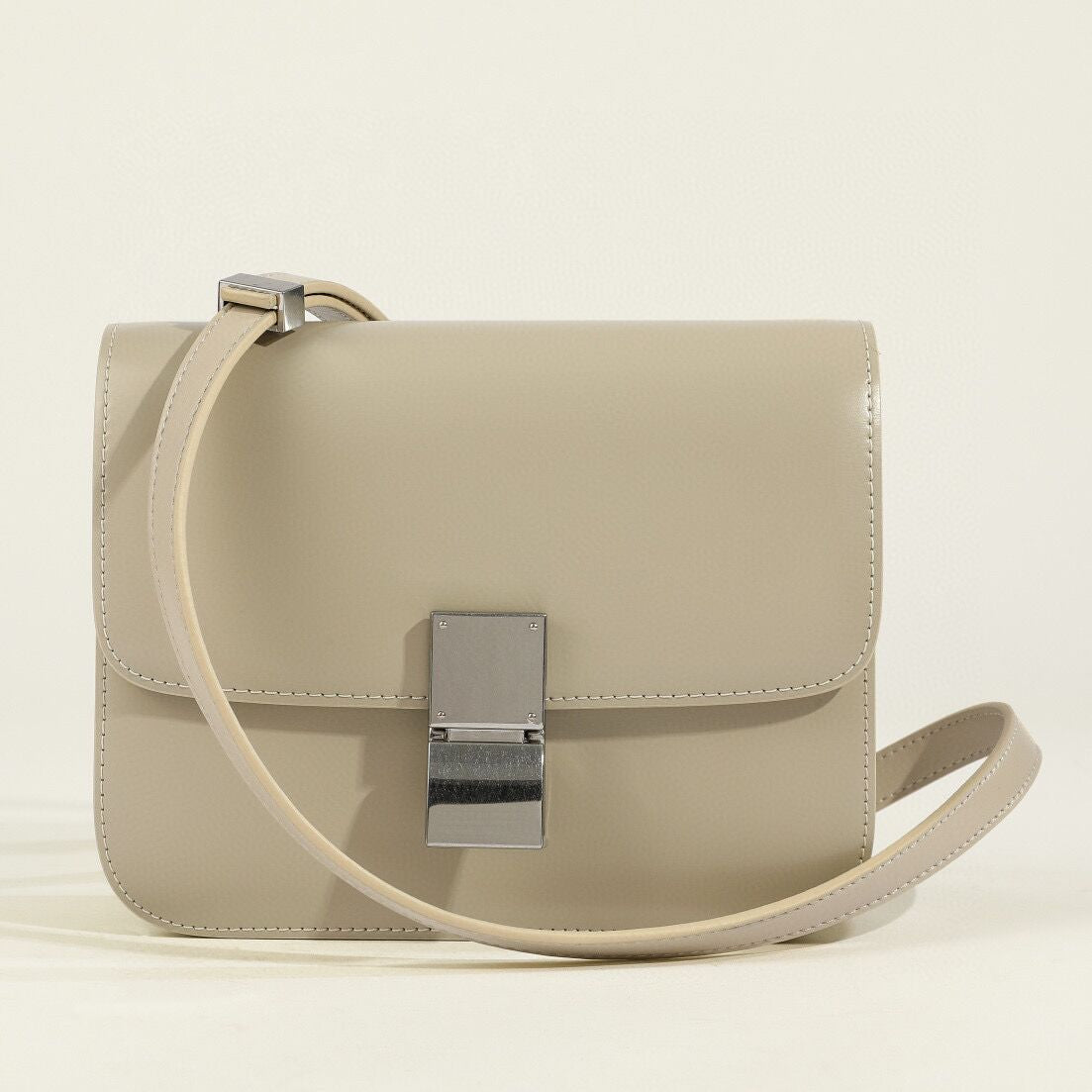 Women's genuine leather structured box shoulder bag with classic flap closure, vintage-inspired compact silhouette