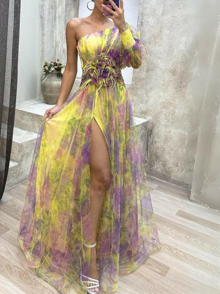 Floral maxi dress one-shoulder silhouette with rosette waist detail and flowing tulle skirt