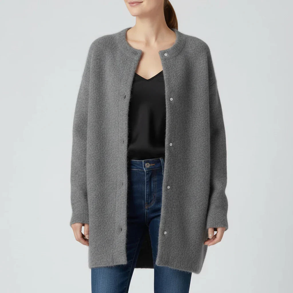 Women's oversized collarless cardigan with button-down front, relaxed minimalist layering style