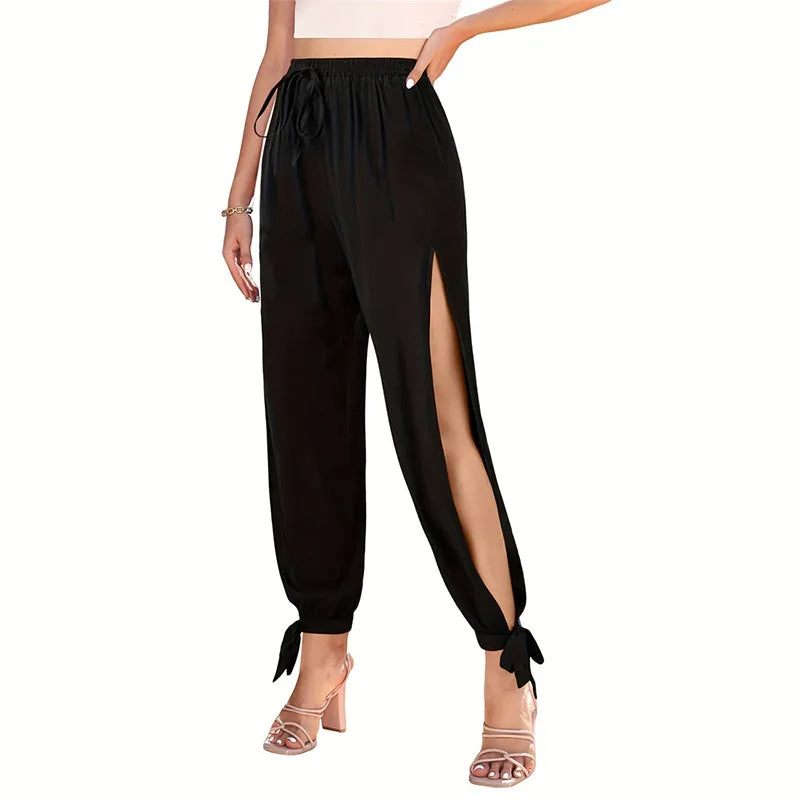 Women's high-waisted lounge pant with bold side slits and adjustable ankle ties, relaxed silhouette