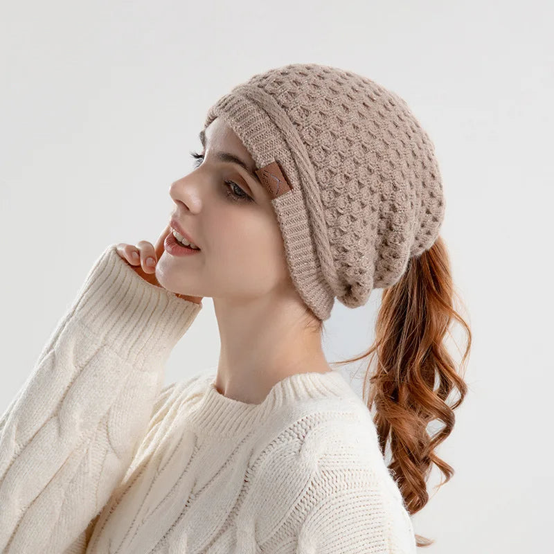 Women's slouchy textured knit wool beanie with ponytail opening, cozy soft fit for all-day warmth