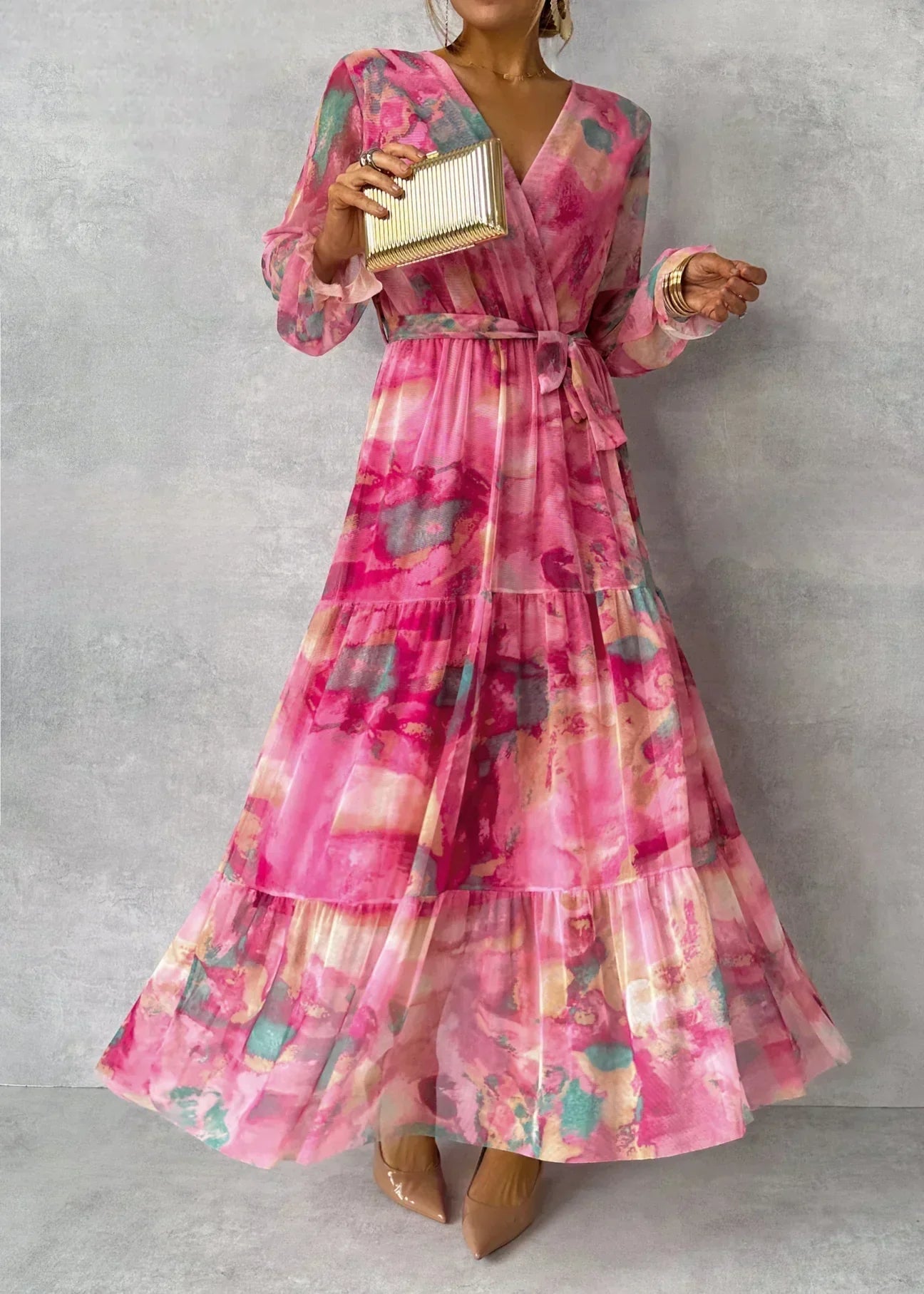 Pink floral maxi dress with long sleeves, elegant flowing silhouette and timeless garden-inspired print