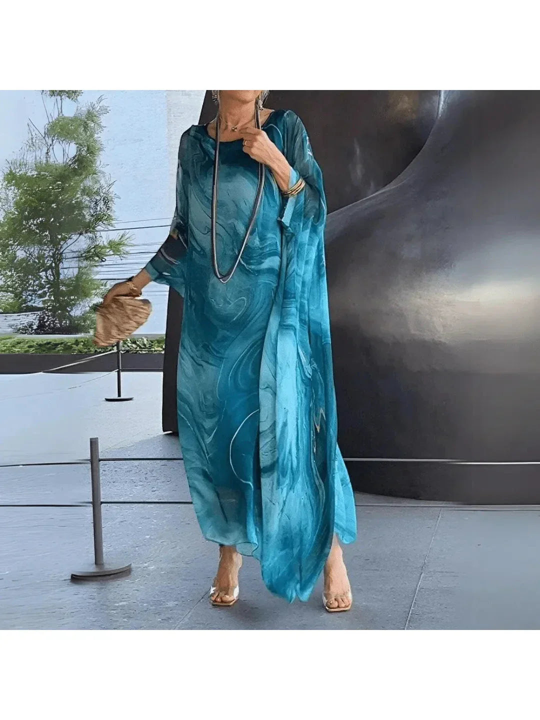 Women's flowing printed maxi dress relaxed ankle-length silhouette lightweight fluid drape warm-weather