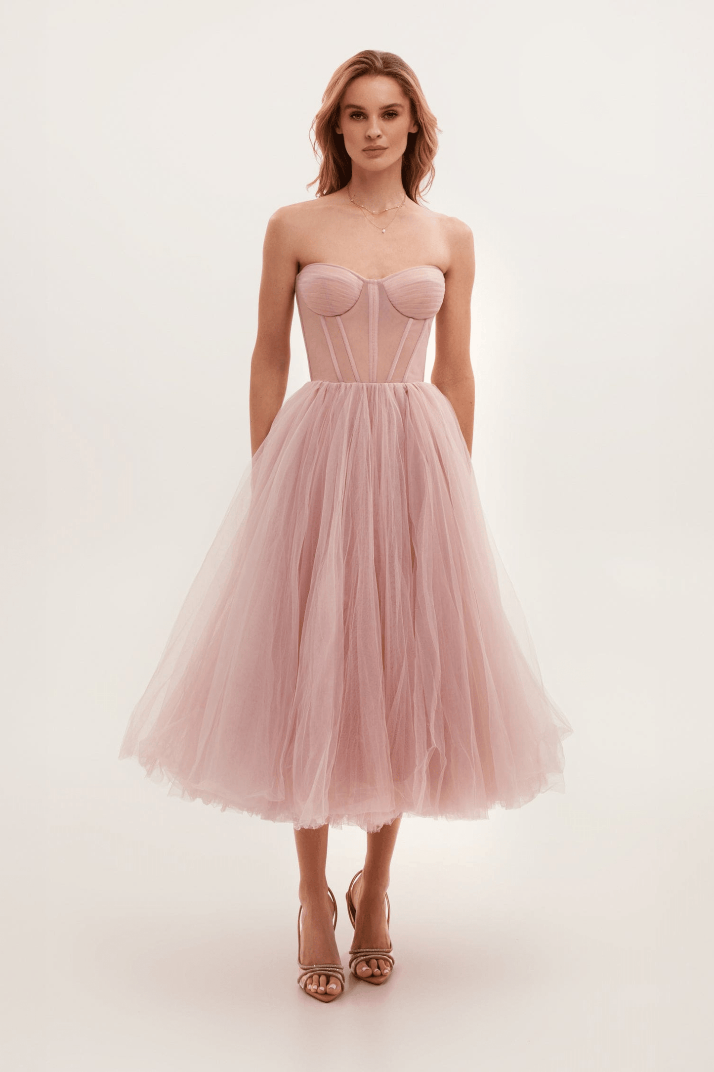 Black bustier evening dress with dramatic floor-length tulle skirt, structured bodice, gala-ready silhouette