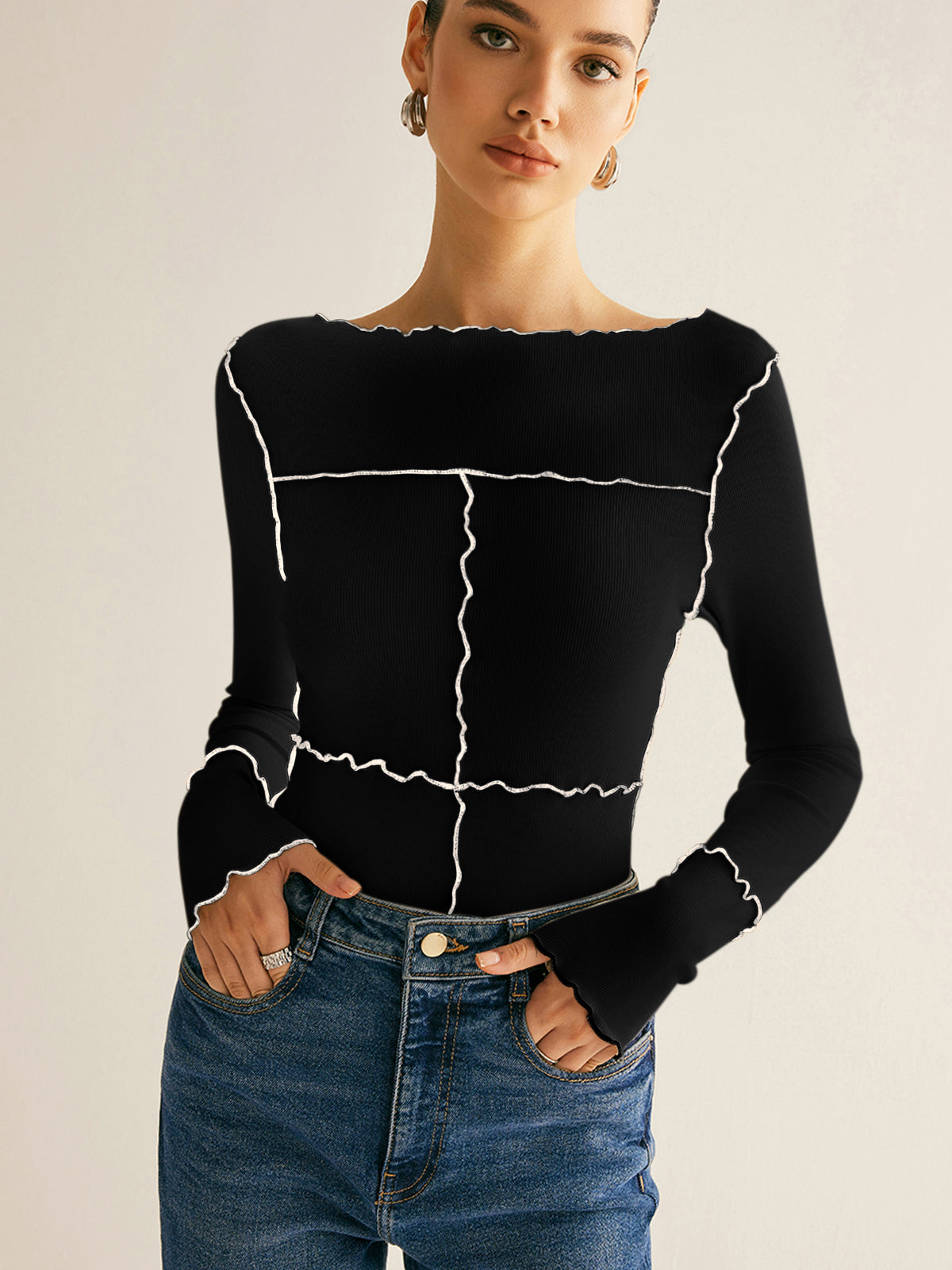 Women's ribbed knit slim long sleeve tee in neutral tone with distinctive lettuce trim edges