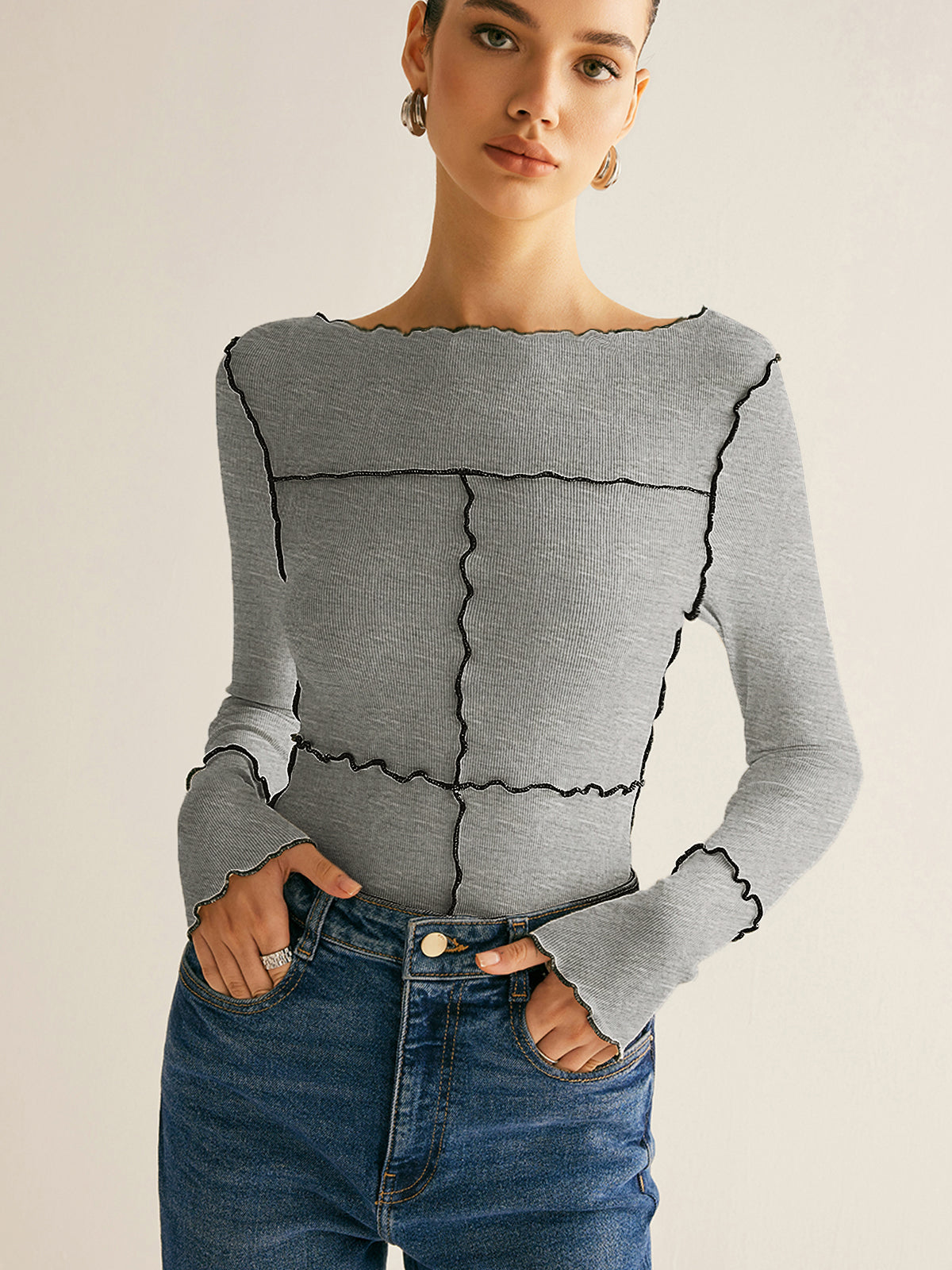 Women's ribbed knit slim long sleeve tee in neutral tone with distinctive lettuce trim edge detail