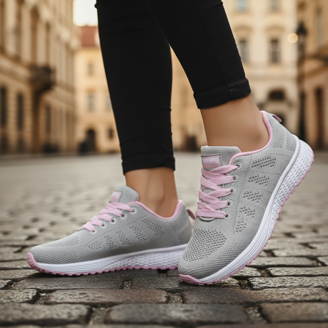 Women's breathable mesh running shoes in black with non-slip white sole for training and daily wear
