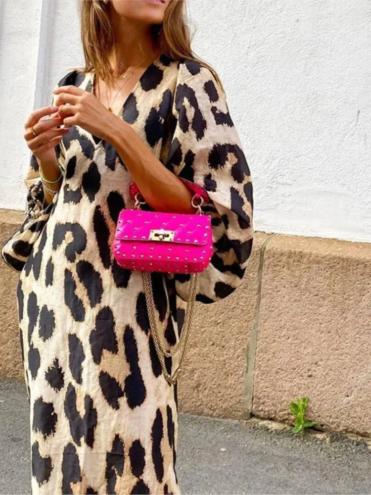 Bold leopard print midi dress with flattering silhouette, a chic statement piece for confident women