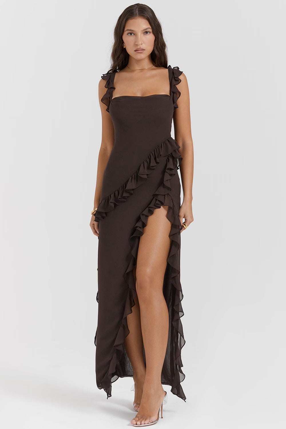 Black ruffle evening gown with asymmetrical trim, fitted bodice, and high slit for formal elegance