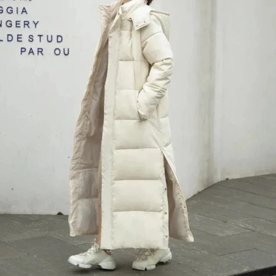 Women's long quilted hooded winter coat with structured fit, pockets, and full-body coverage