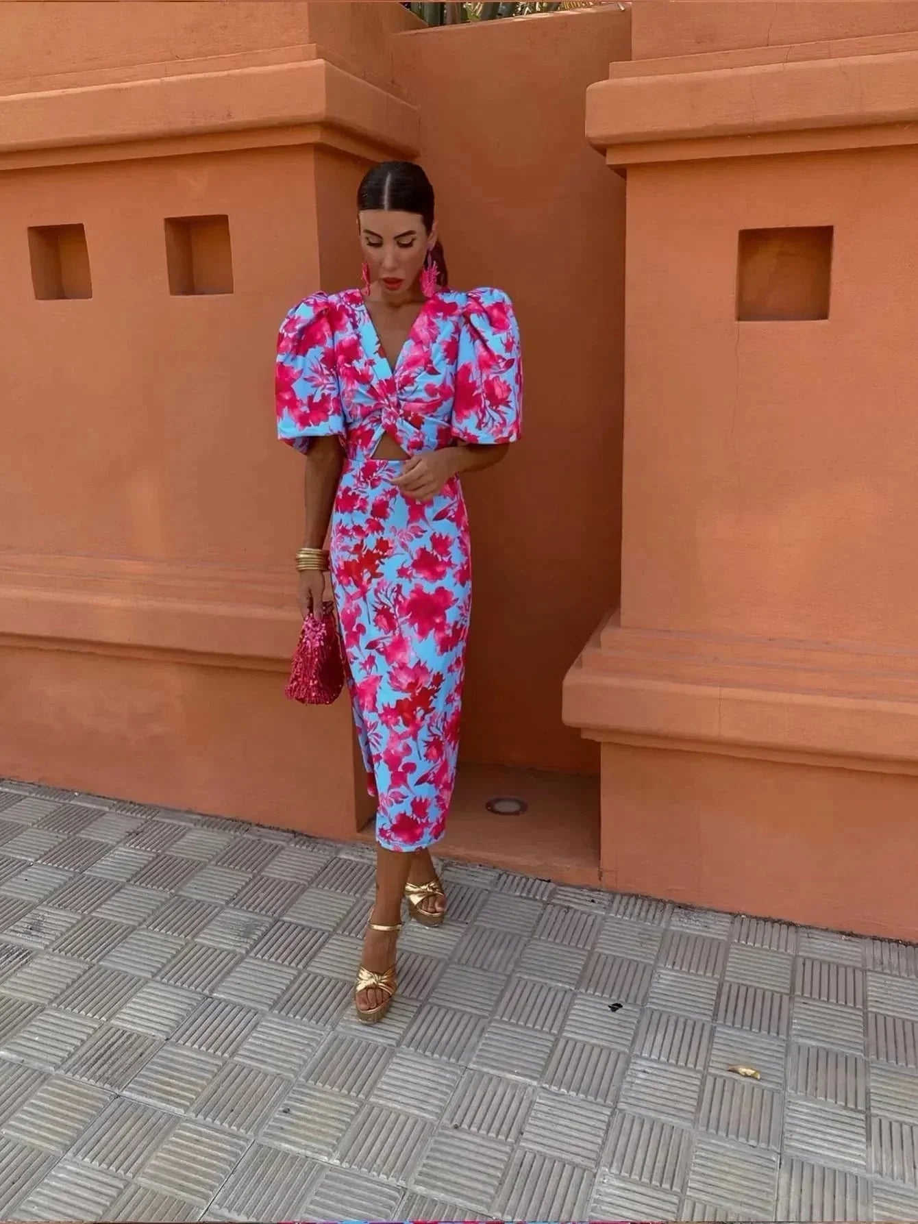 Vibrant puff sleeve bodycon midi dress with V-neck in bold colorful print, flattering silhouette