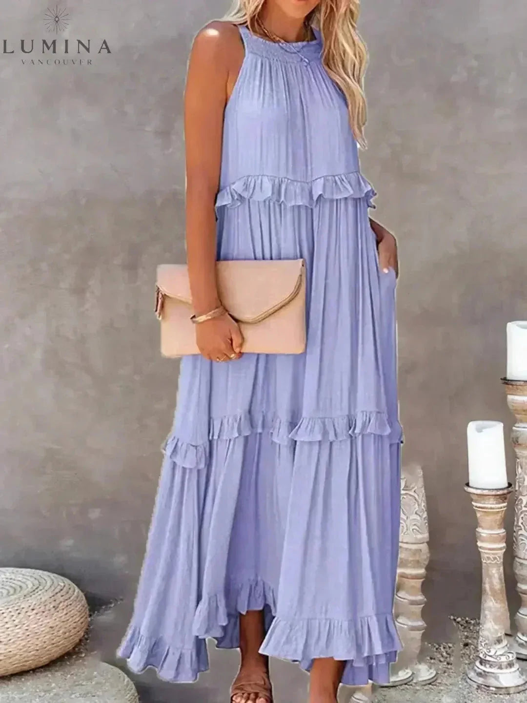 Lorena white halterneck maxi dress with ruffles, pockets, and adjustable back bow tie