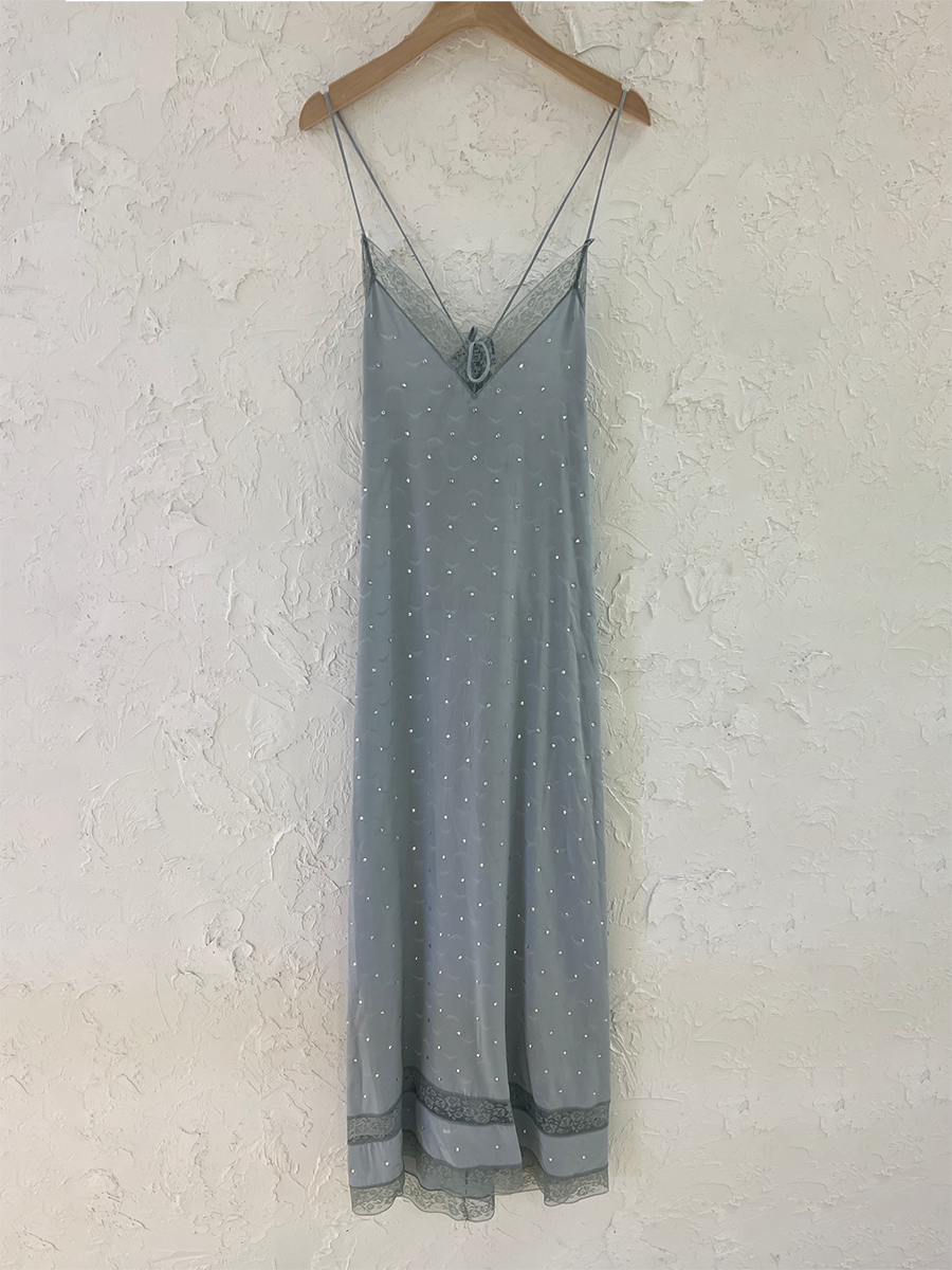 Ivory silk midi dress sleeveless V-neck with delicate lace embroidery flowing sophisticated silhouette