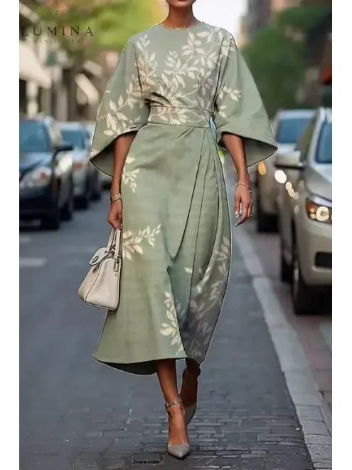Elegant floral women's dress with flowing silhouette, soft draping, and delicate all-over floral pattern