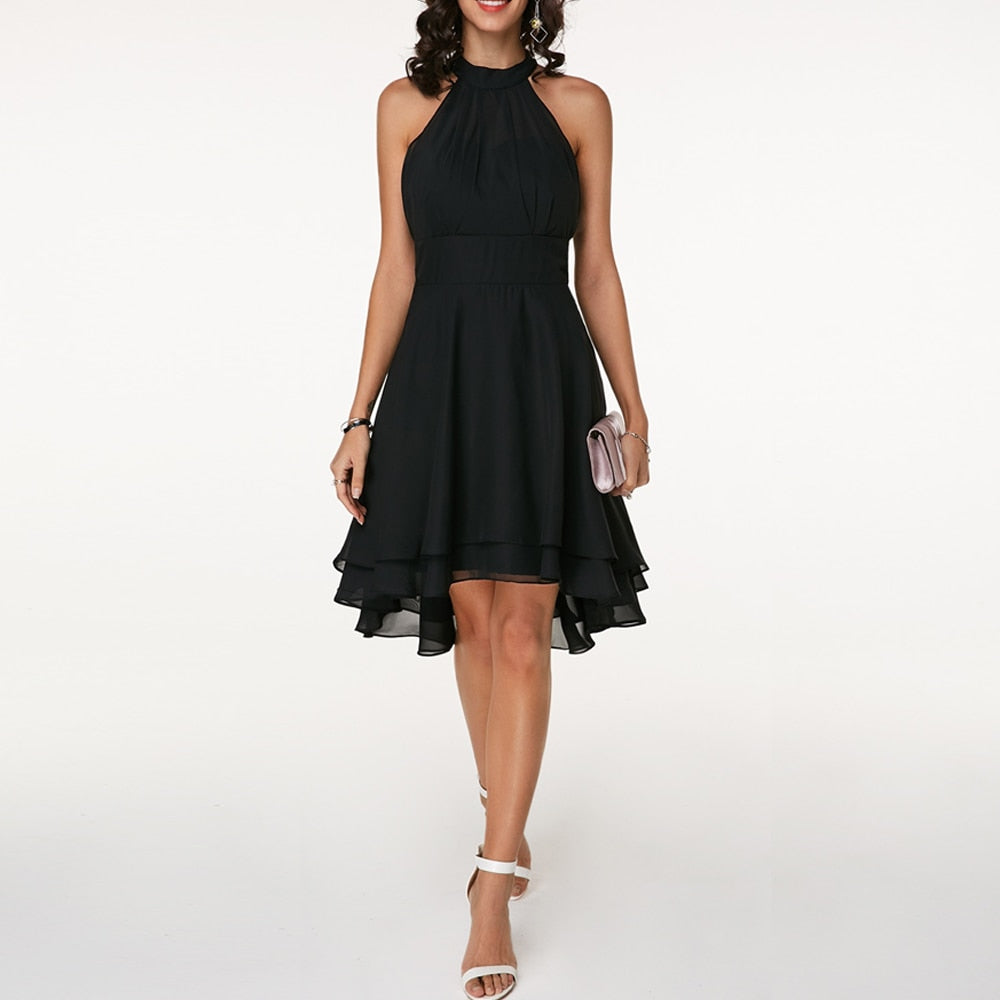 Black halter neck cocktail dress with cinched waist and flowing multi-tiered layered skirt