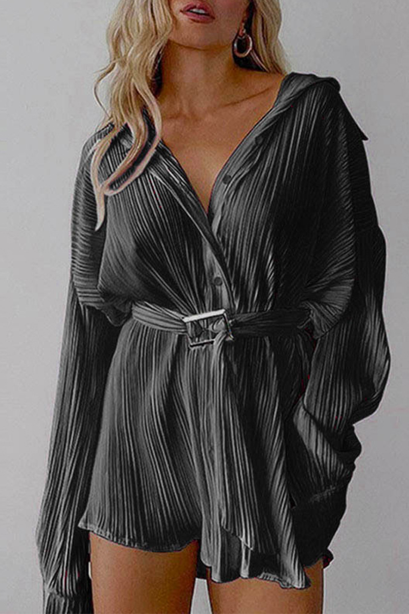 Women's pleated mini shirt dress in neutral tone with belted waist and button-down silhouette