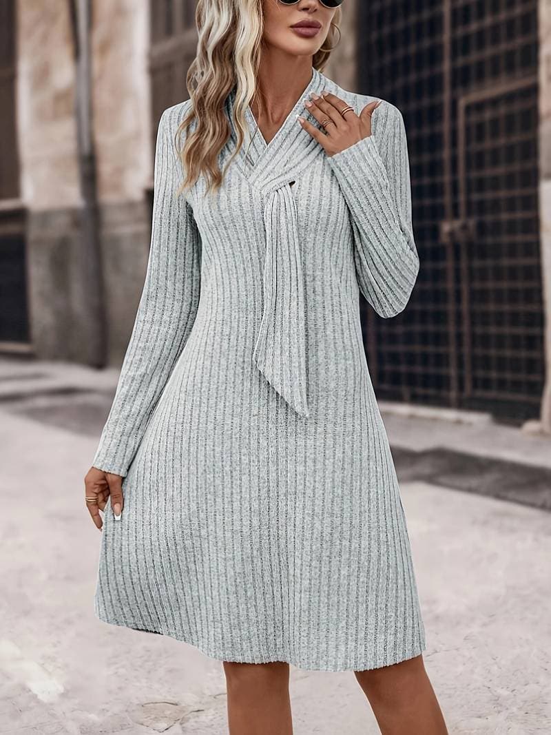 Knee-length black knit dress scarf neck long sleeves sculpting semi-fitted silhouette city style