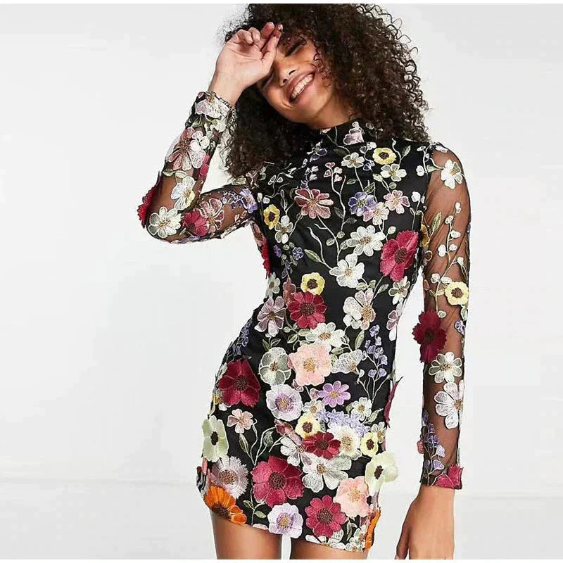 Multicolor floral embroidered sheer mesh mini dress with long sleeves, couture-inspired nightlife style