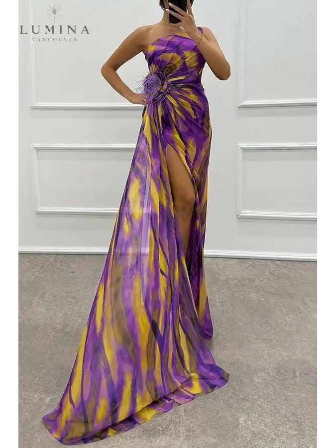 Vibrant printed maxi dress one-shoulder neckline side slit modern eveningwear silhouette