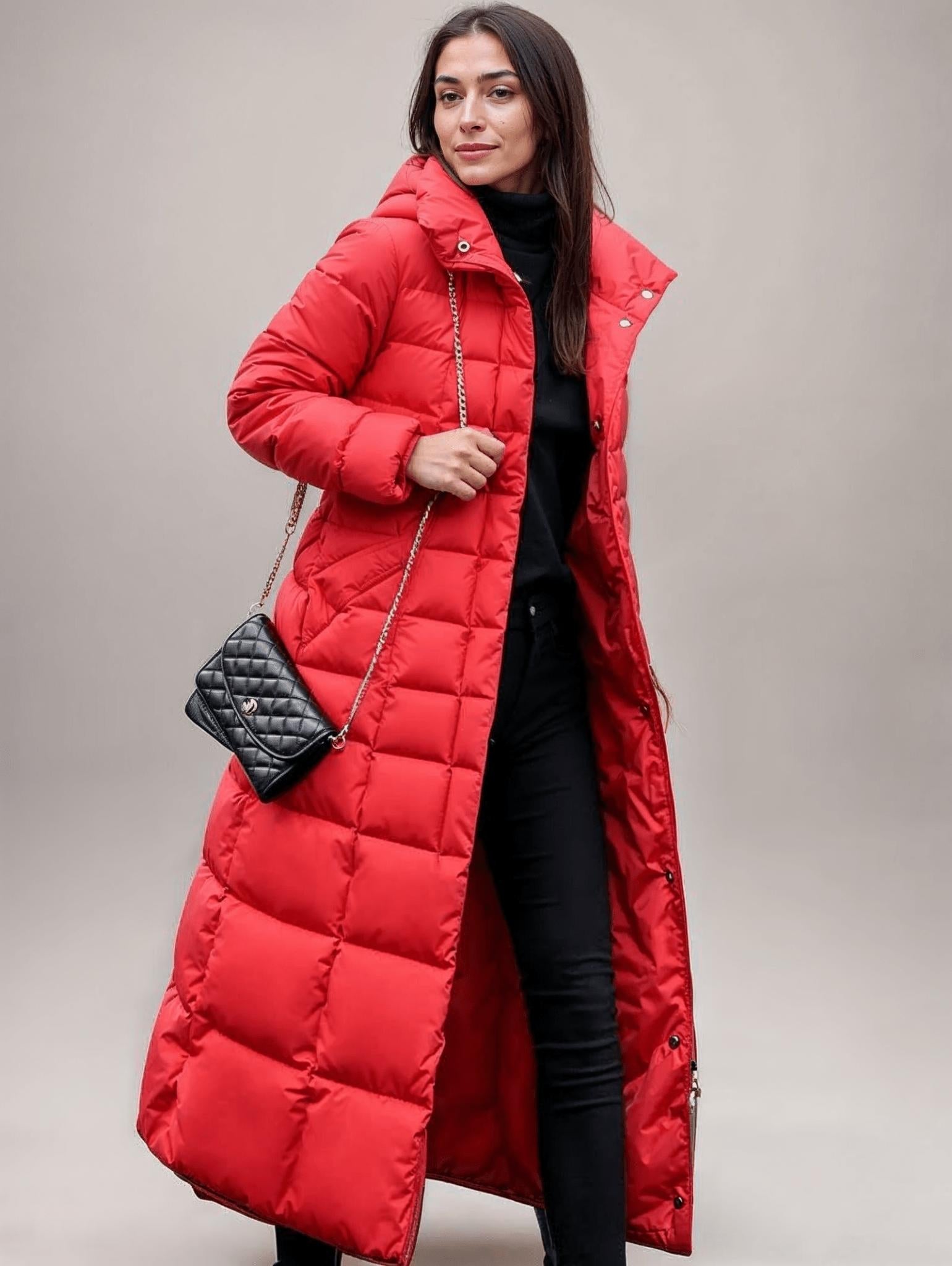 Women's long puffer jacket with belted waist, hood, and snap buttons for winter wind protection