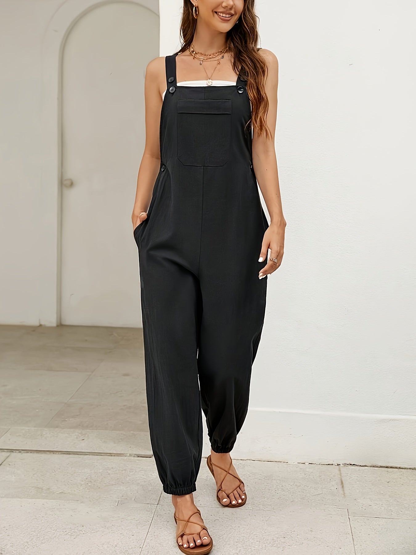 Women's relaxed-fit cotton-blend studio jumpsuit in neutral tone with fluid draped silhouette