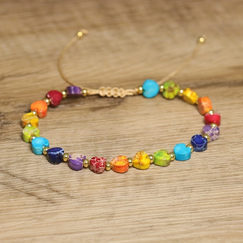 Adjustable stone bracelet with heart-shaped gemstones, gold-tone accents, and sliding knot closure