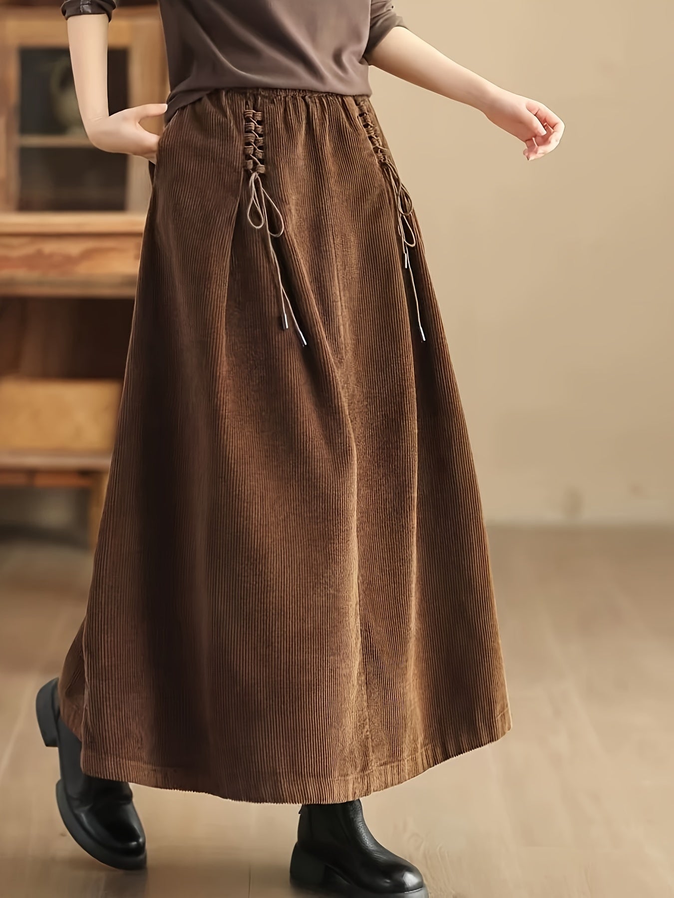 Women's brown corduroy maxi skirt wide A-line silhouette with corset waist and deep pockets