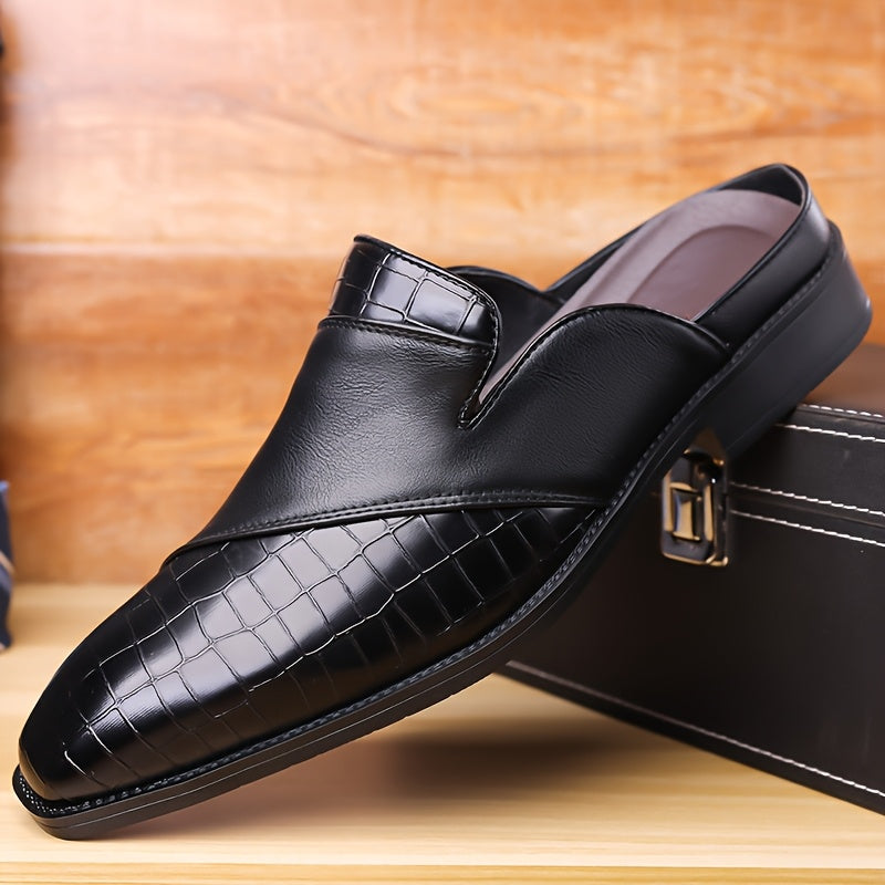 Men's brown crocodile-embossed leather mule loafer with open-back slip-on design and cushioned footbed