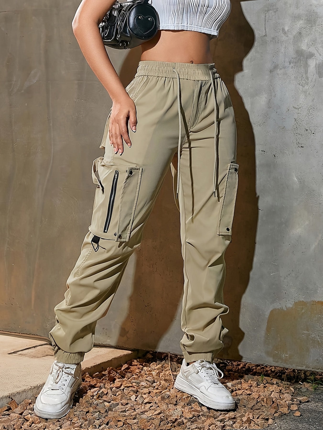 Men's black cargo jogger pants lightweight tech fabric oversized pockets D-ring hardware streetwear