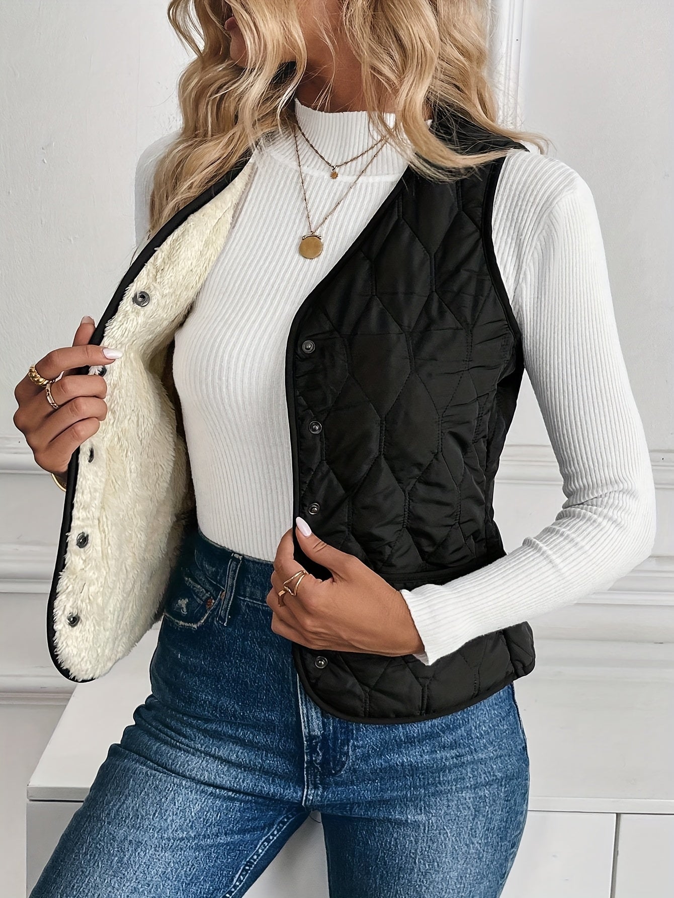 Unisex quilted bomber vest in neutral tone, lightweight diamond-quilted shell with ultra-soft sherpa lining