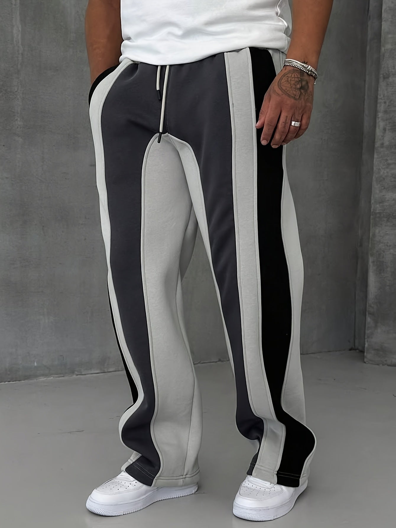 Black and gray heavyweight cotton fleece colorblock sweatpants with bold triple-panel streetwear design