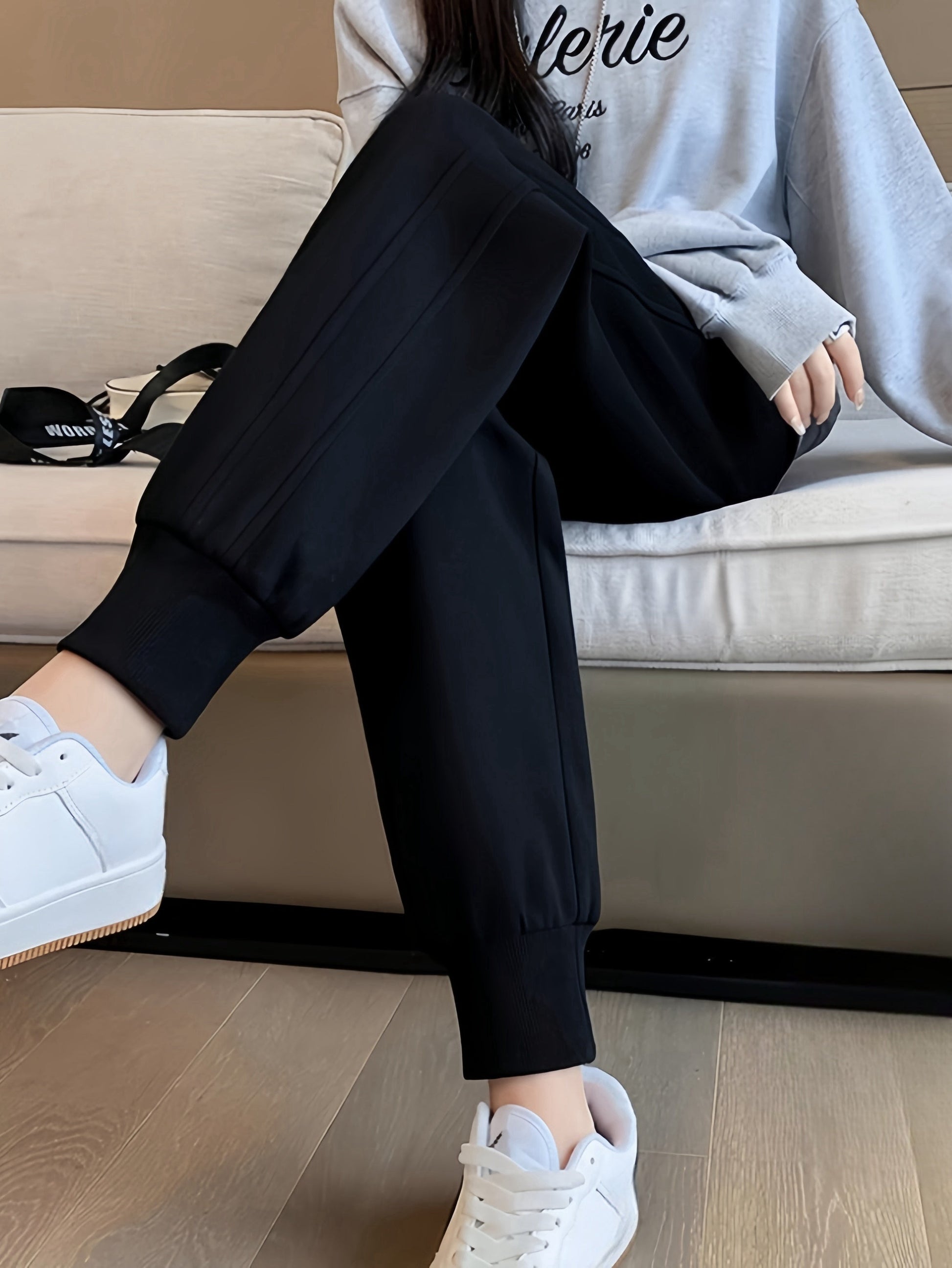 Dark heather gray high-rise fleece jogger with plush brushed lining and sculpted tapered fit