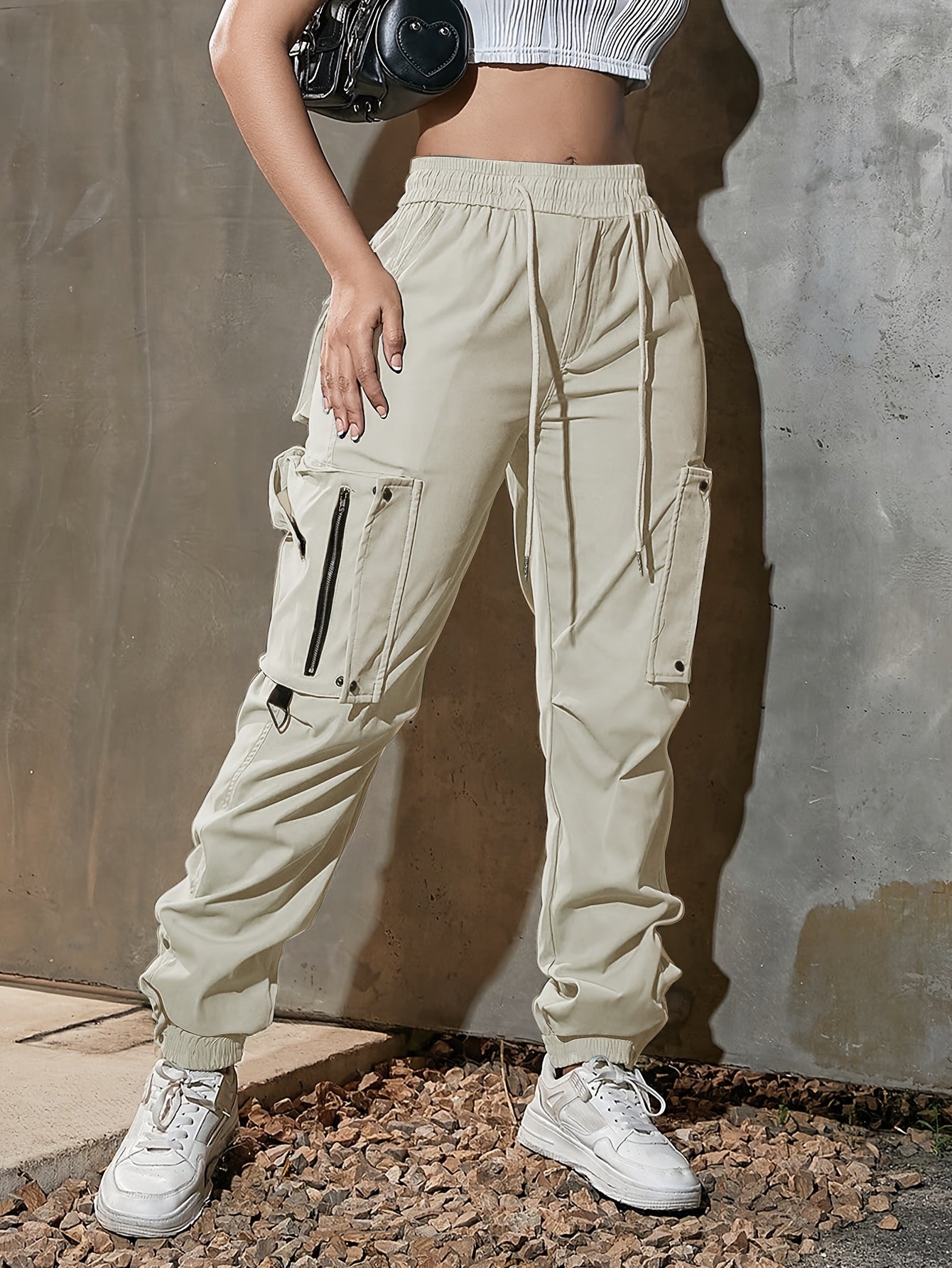 Men's black cargo jogger pants lightweight tech fabric oversized pockets D-ring hardware streetwear