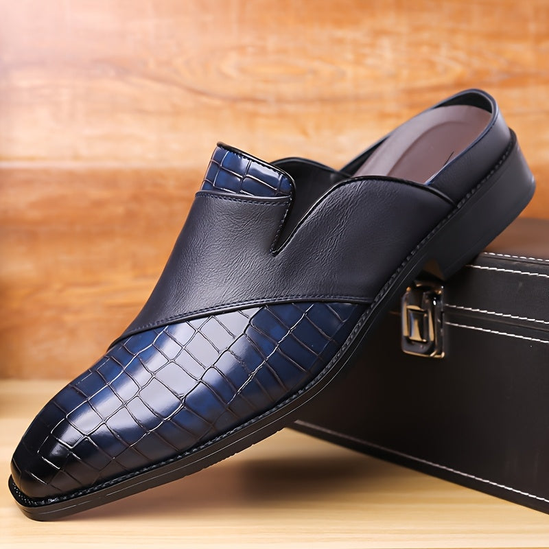 Men's brown crocodile-embossed leather mule loafer with open-back slip-on design and cushioned footbed
