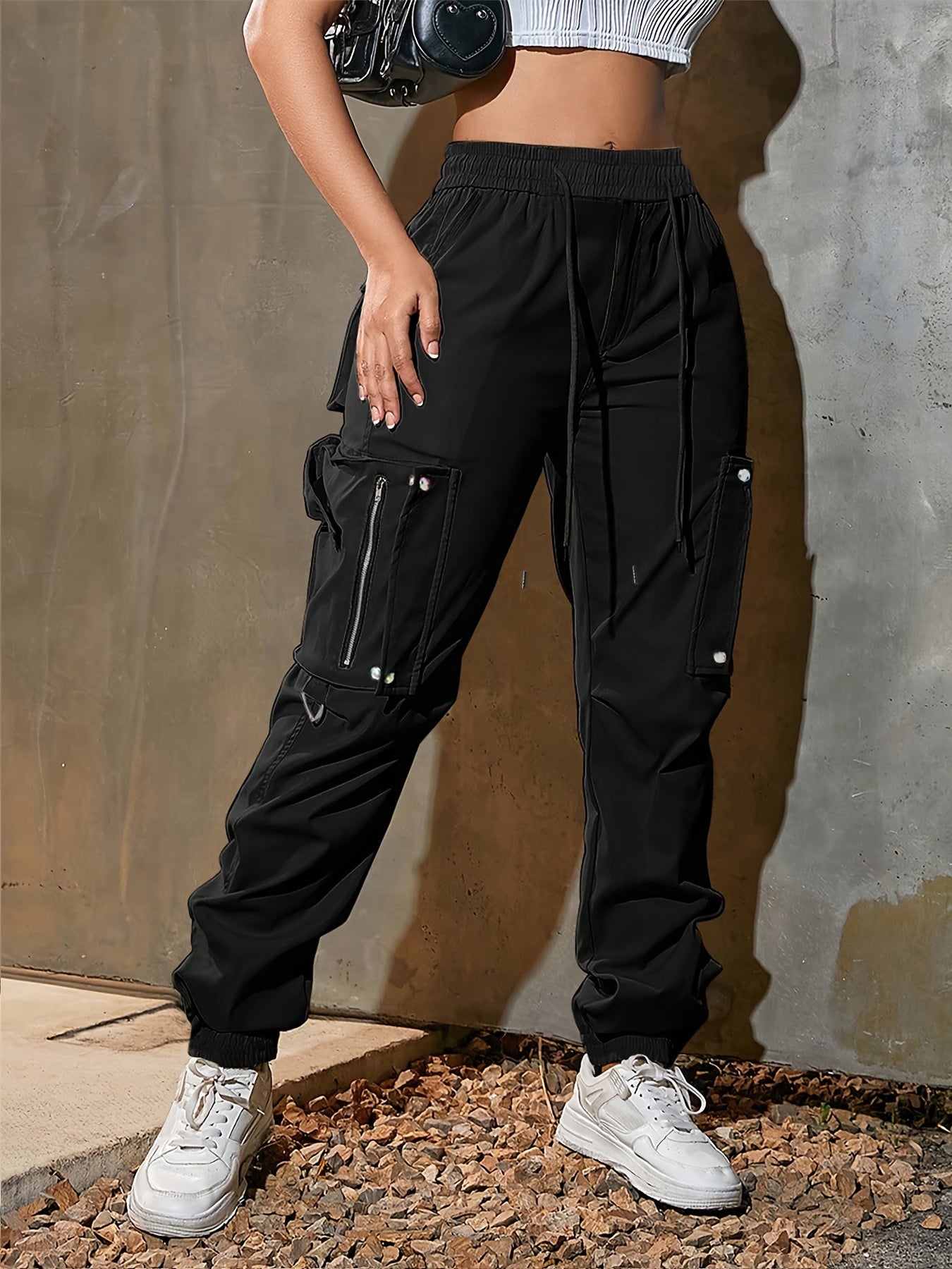 Men's black cargo jogger pants lightweight tech fabric oversized pockets D-ring hardware streetwear
