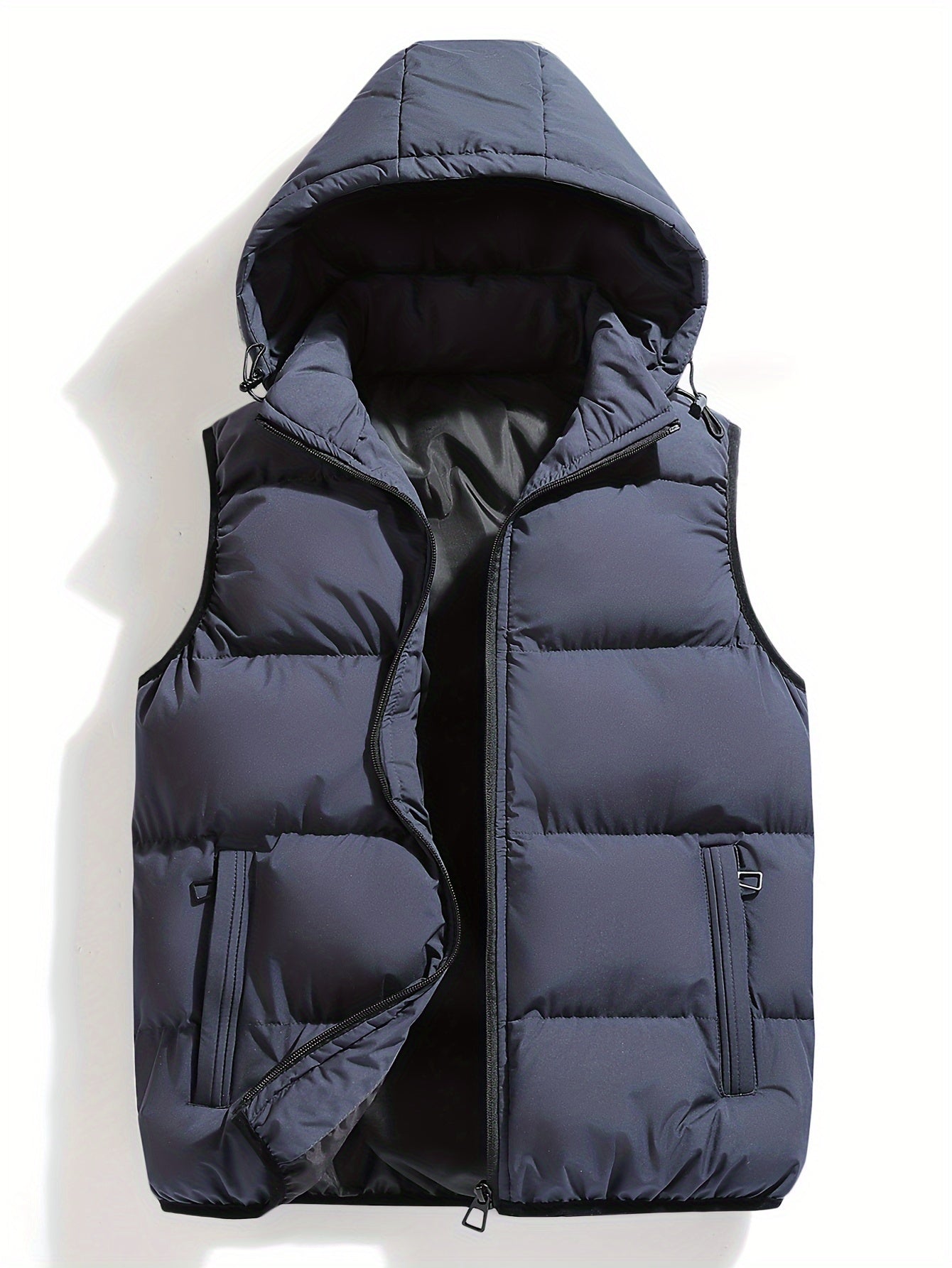 Black hooded puffer vest lightweight insulated weather-resistant shell with detachable hood for outdoor wear
