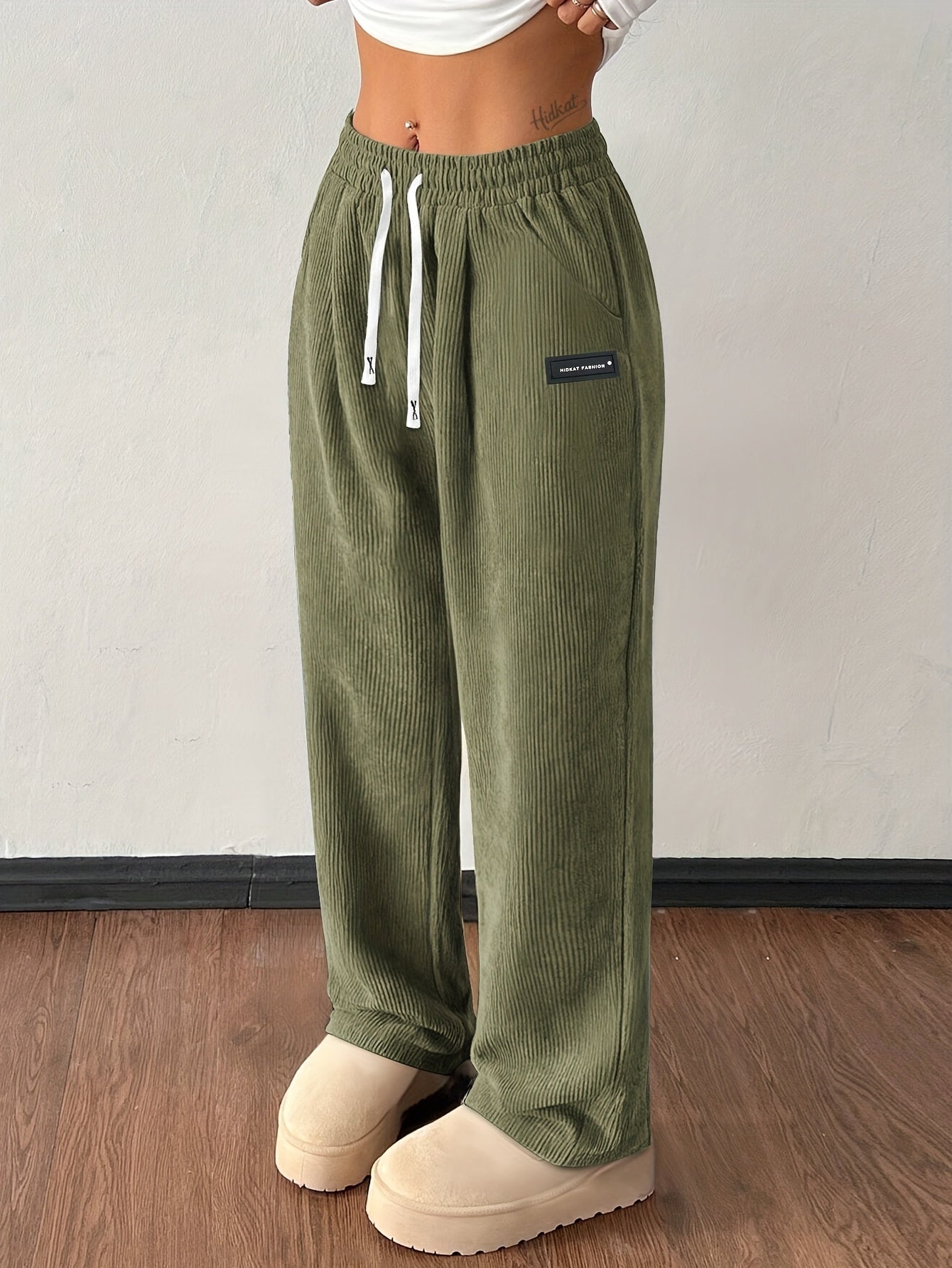 Women's brown corduroy wide-leg jogger pants with high-rise drawstring waist and deep pockets