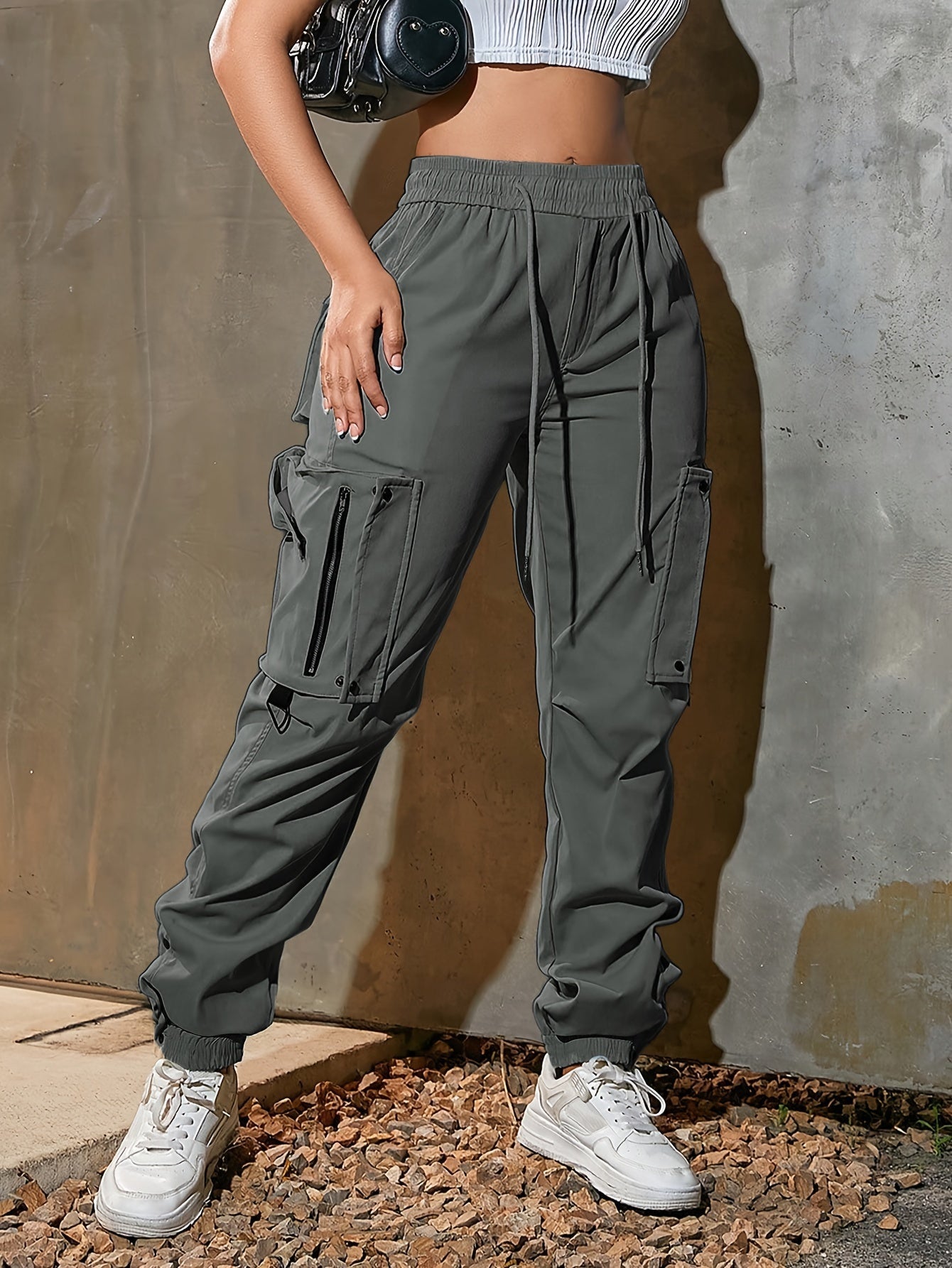 Men's black cargo jogger pants lightweight tech fabric oversized pockets D-ring hardware streetwear