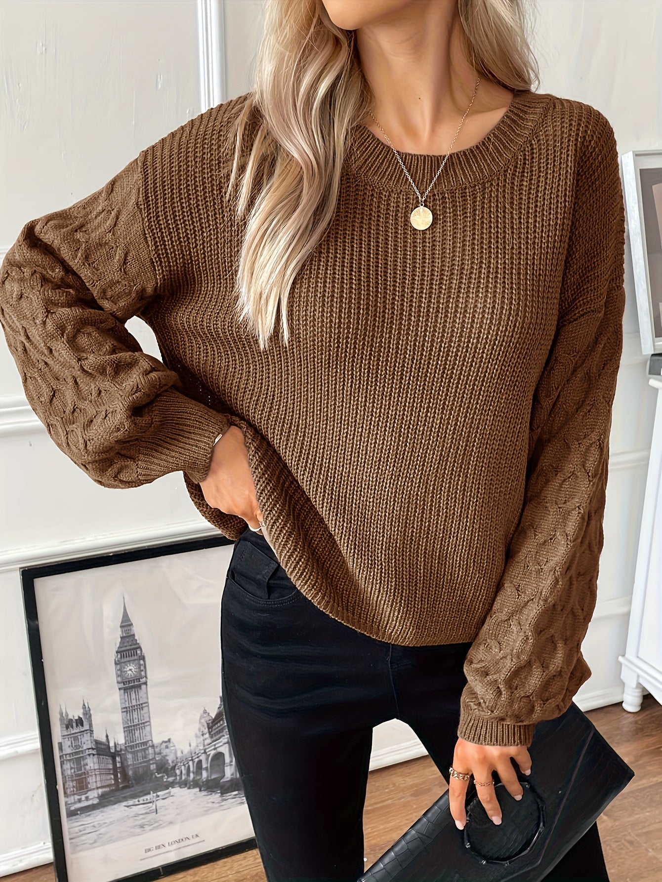 Cream diamond knit pullover with dropped shoulders, ribbed body, and sculptural texture for modern fit