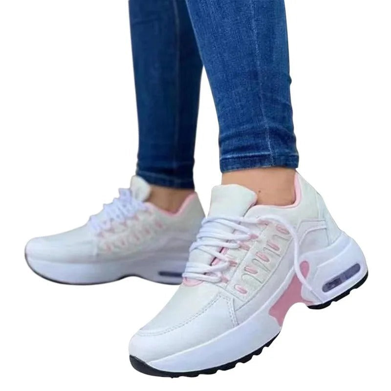 White orthopedic non-slip sneakers with arch support, lightweight flexible sole for healthcare professionals
