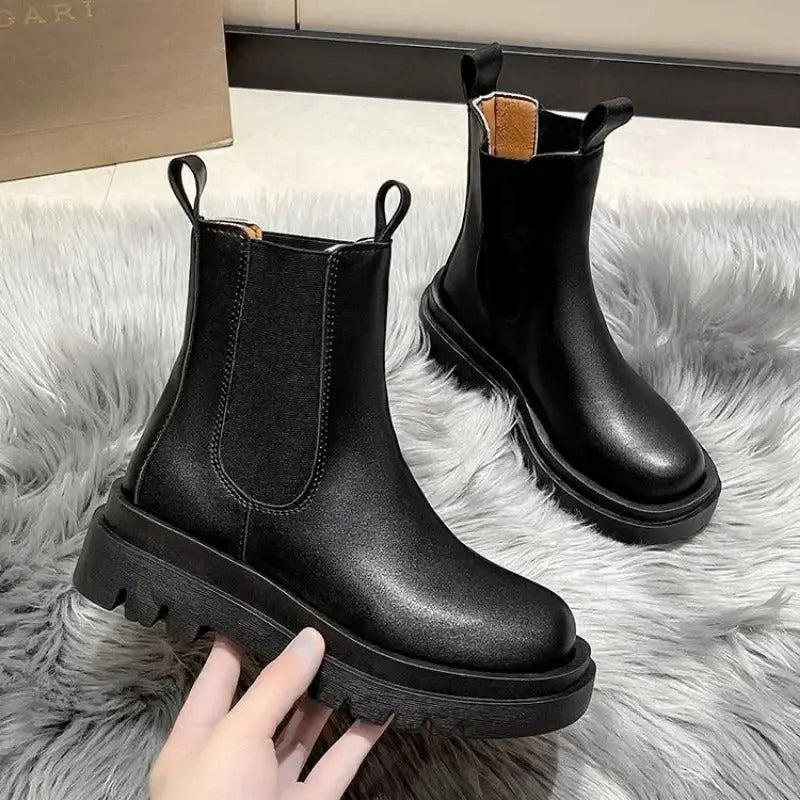 Black thick sole slip-on boots bold chunky silhouette premium finish everyday women's fashion footwear