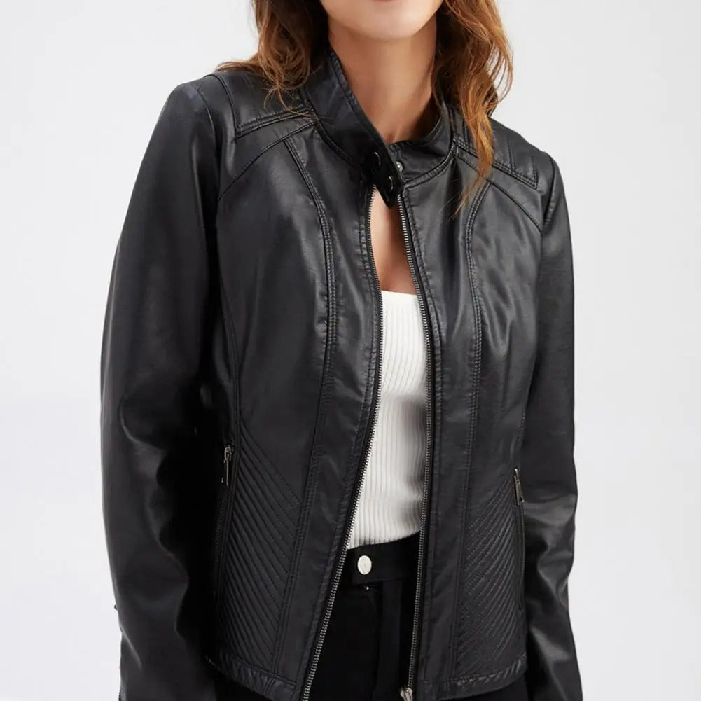 Women's black moto jacket with stand collar, quilted side panels, and snap-tab closure