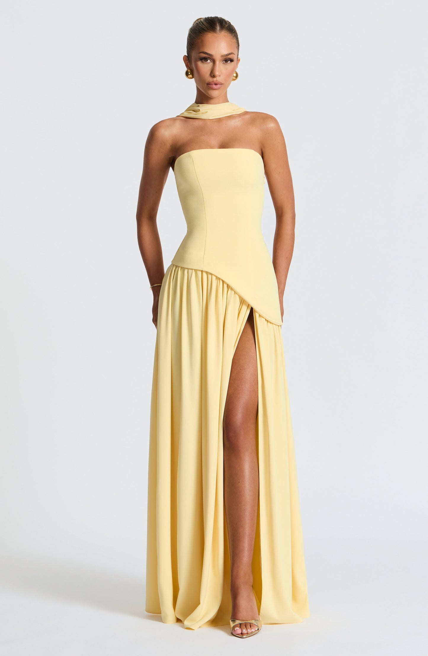 Black strapless evening gown sculpted bodice high slit flowing draped skirt formal elegant silhouette
